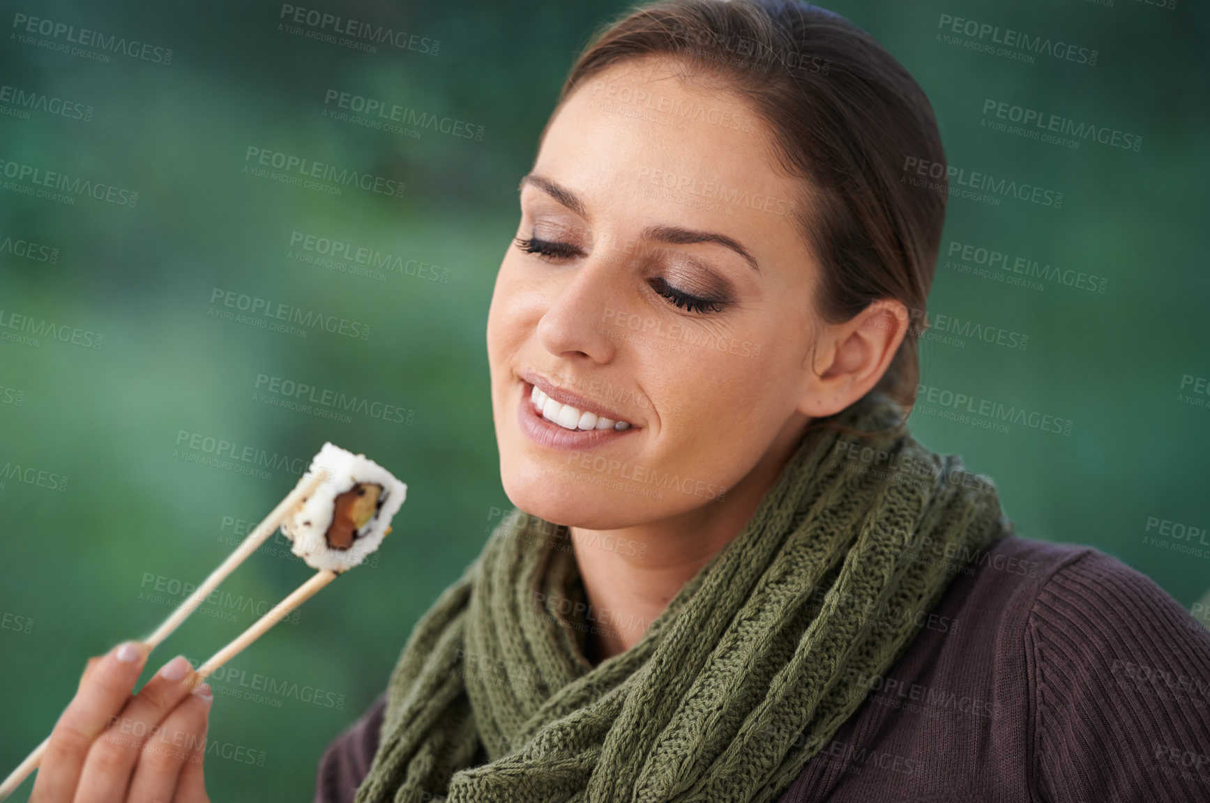 Buy stock photo Woman, sushi and happy in home, hungry or eating with chopsticks for wellness, diet or ideas. Person, fish and smile for lunch, nutrition or snack with takeaway food in house, apartment and thinking