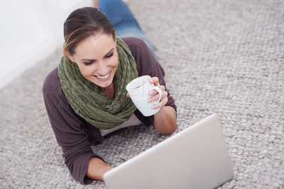 Buy stock photo Home, laptop and woman on the floor, smile and typing with coffee and connection in a lounge. Person, apartment or girl with computer, espresso and research for a project, freelancer or copywriting