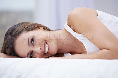 Buy stock photo Woman, happy and relaxing in bed on weekend, lazy and comfortable on morning at home. Female person, smiling and satisfaction while resting in bedroom, wake up and good mood on vacation or holiday