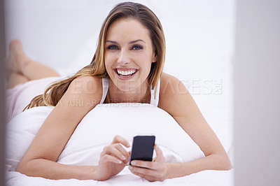Buy stock photo Woman, bedroom portrait and phone for social media, search online and communication or streaming at home. Happy person relax on her bed with mobile for chat, contact and internet connection or break