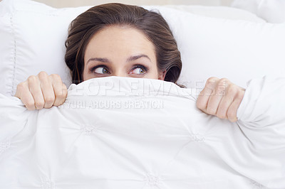 Buy stock photo Morning, scared woman in bed and under cover, wake up and relax getting ready hiding from new day. Blanket, face and girl in bedroom with rest, wellness and comfort in hotel room, home or apartment.