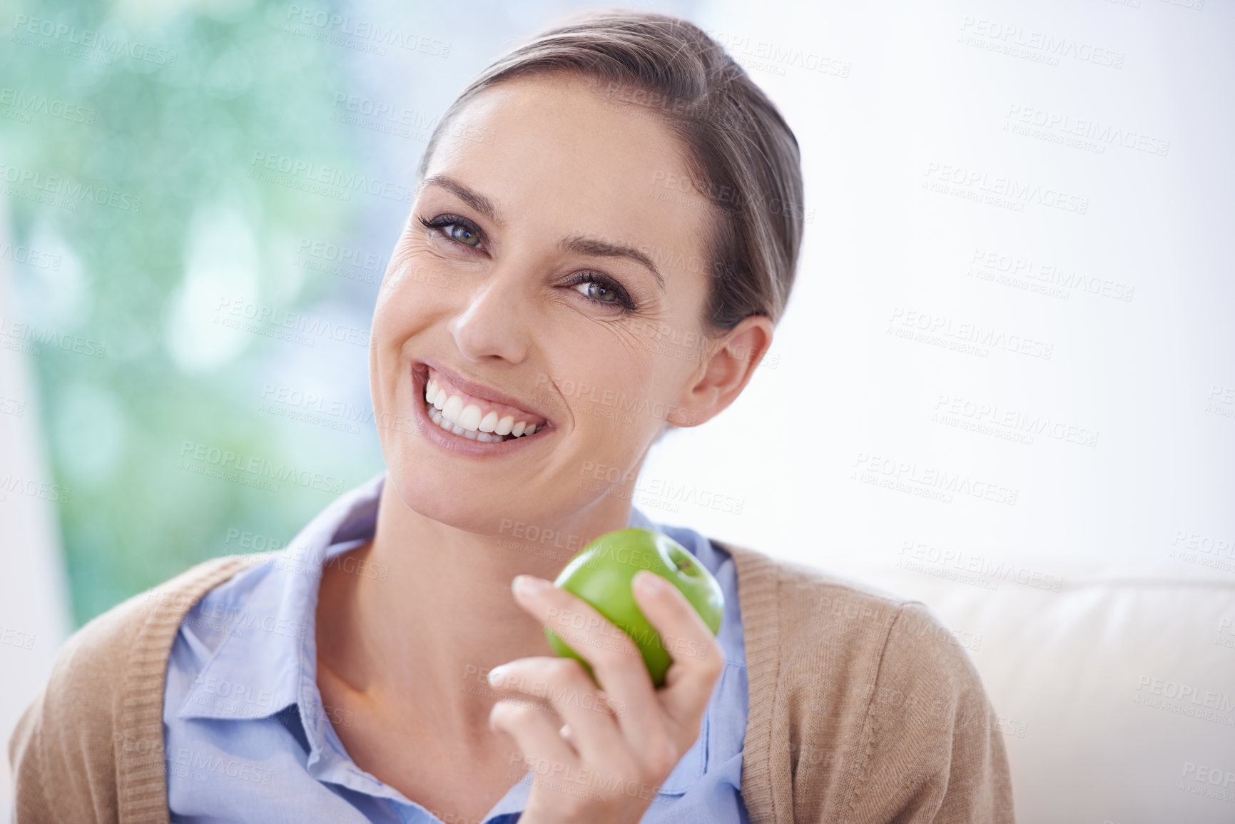 Buy stock photo Portrait, home or happy woman with apple for healthy or balanced diet with nutrition, smile or vitamins. Face, relax and vegan person eating fresh fruit, food or fibre for organic wellness in lounge