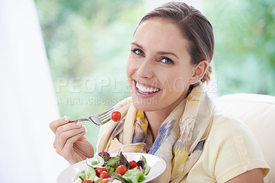 Buy stock photo Woman, smile and eating salad in home for diet, health and wellness with pride at lunch in lounge. Person, food and hungry with vegetables, plate and nutrition with vitamins, fiber and relax in house