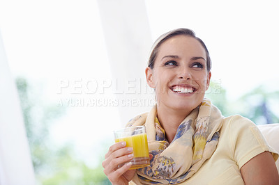 Buy stock photo Woman, smile and drink orange juice from glass in home, thinking and memory with choice for detox on sofa. Person, fruit punch or liquid with ideas, relax and happy on lounge sofa in apartment