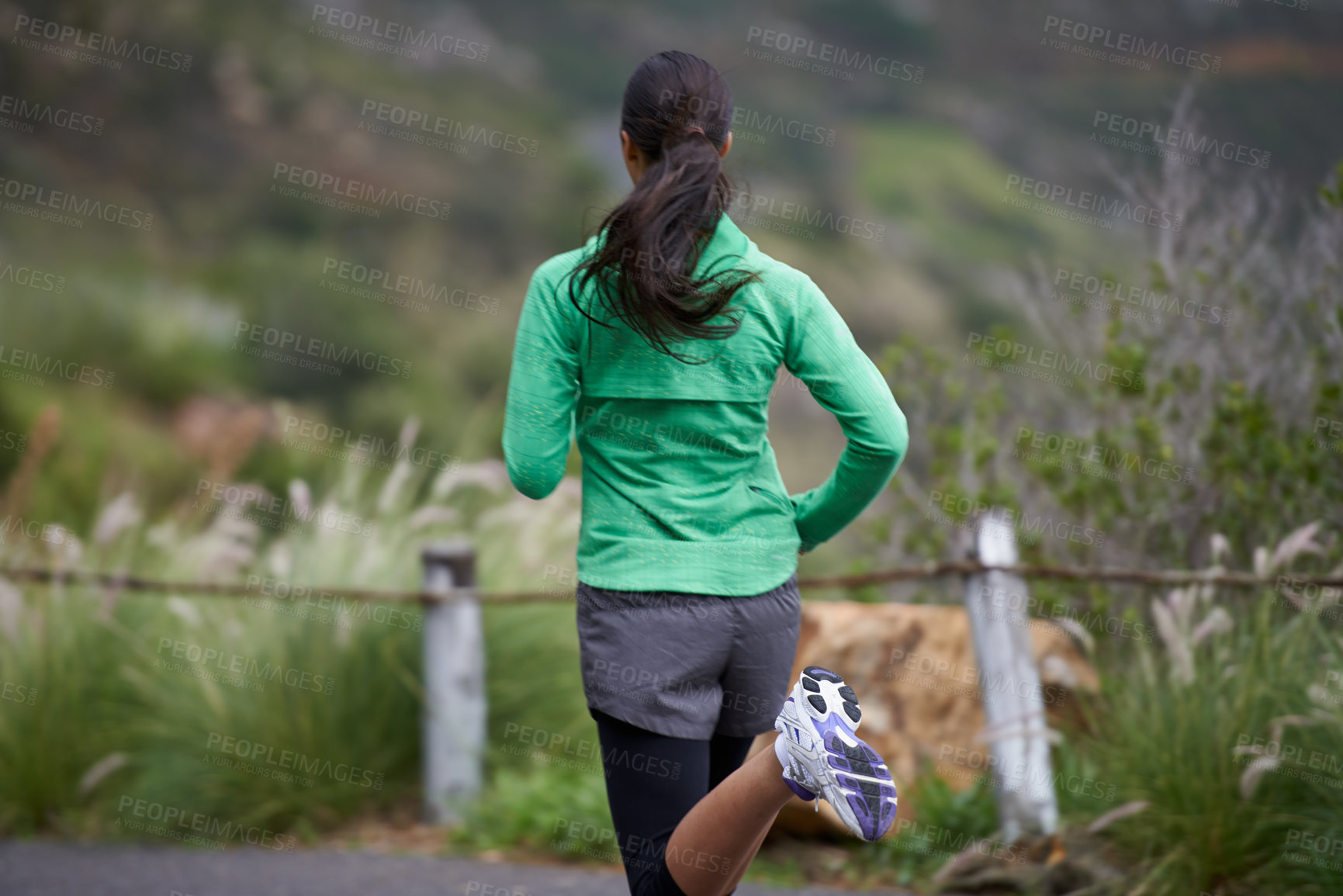 Buy stock photo Back, road and running with woman, fitness and morning with fresh air and exercise for health, wellness and cardio. Person, runner or athlete with workout or training with nature, energy or challenge
