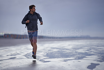 Buy stock photo Running, beach and man with vacation, travel and exercise with nature, explore and ocean. Person, runner and guy with fun, water and sunset with wellness and breathing with workout, energy and Miami