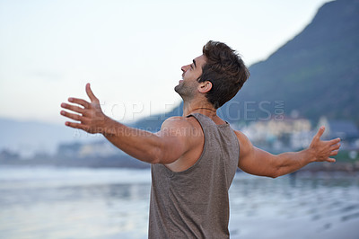 Buy stock photo Beach, happy and excited with man, holiday and journey with wellness and freedom. Person, outdoor and guy with arms raised, peace and happiness with vacation and adventure with journey and seaside