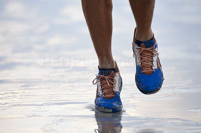 Buy stock photo Water, running and feet outdoor for fitness, sports and training in nature closeup. Legs, zoom and sneakers of person at the ocean for exercise, workout or morning cardio, marathon or seaside workout