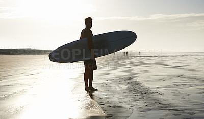 Buy stock photo Sunset, surfing and silhouette of man at a beach with surfboard for freedom, travel or sports outdoor. Ocean, training and surfer shadow at sea for swimming, wellness or adventure, workout or holiday