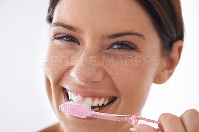 Buy stock photo Toothbrush, happy and portrait of woman on a white background for dental care, oral hygiene or cleaning. Healthcare, whitening and face of person brushing teeth with toothpaste for wellness in studio