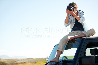 Buy stock photo Man, photographer and camera on car with sky for road trip, adventure or journey on rooftop with travel. Person, photography or memories for vacation, holiday or scenery in Asia on mock up in nature