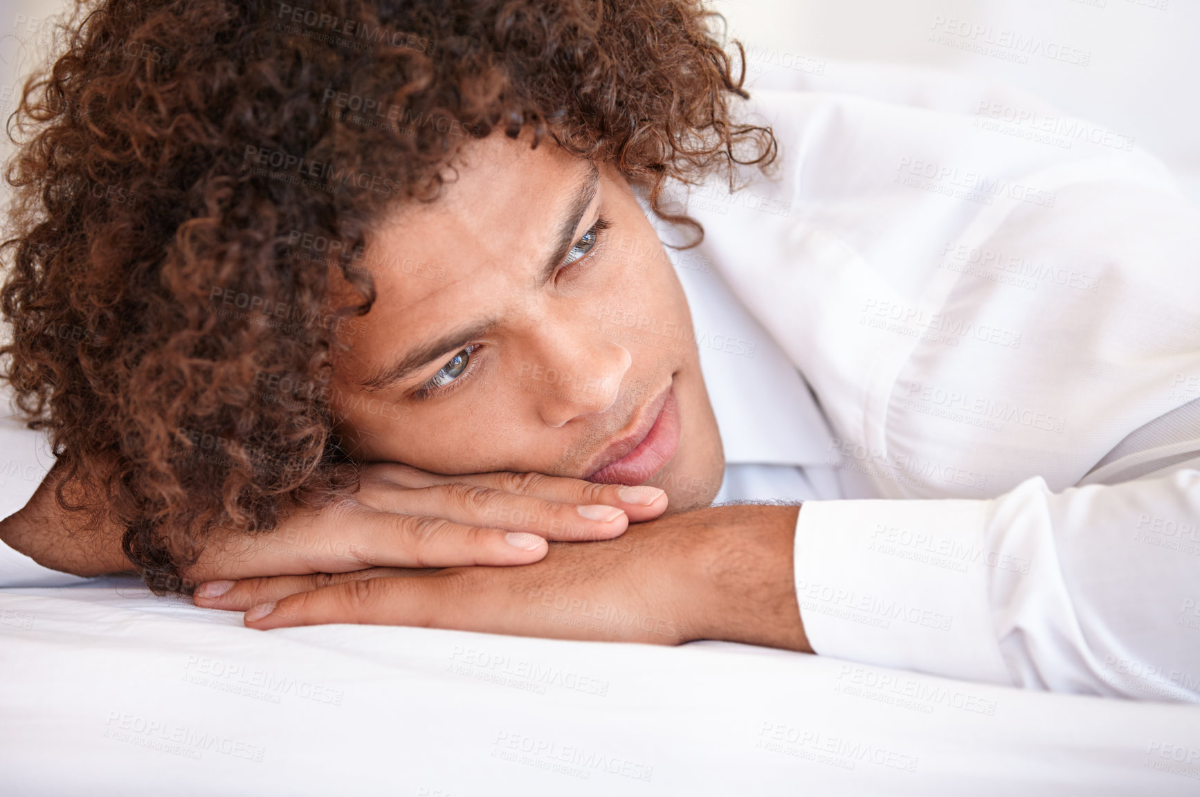 Buy stock photo Man, thinking and relaxing in bed on weekend, lazy and comfortable on morning at home. Male person, peaceful and daydreaming while resting in bedroom, wake up and contemplating on holiday or getaway