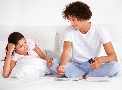 Buy stock photo Phone, finance and writing with couple on bed of home for budget, accounting or investment planning together. Documents, money or savings with happy young man and woman in bedroom of apartment