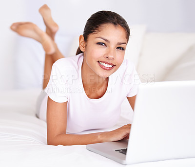 Buy stock photo Portrait, bed and happy woman with laptop for student research project, social network and online news at home. Bedroom, communication and face of studying person with web search on remote work