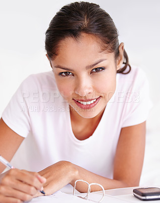 Buy stock photo Woman, writer and planning in journal, portrait and inspiration or research in bed at home. Female person, author and writing notes in book for project, brainstorming and contemplation in bedroom