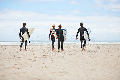 Buy stock photo Young surfers excited about hitting the awesome waves