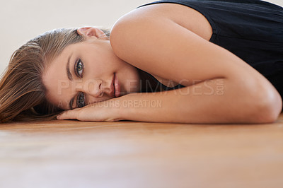 Buy stock photo Portrait, beauty or woman on wooden floor in home to relax alone in Switzerland. Natural face, serious person or attractive young girl lying in house, apartment or lounge for skin aesthetic on mockup