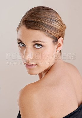 Buy stock photo Portrait, beauty and serious woman in studio isolated on a brown background. Face, shoulder and young model shine in cosmetics, healthy skin glow and spa facial treatment for skincare dermatology
