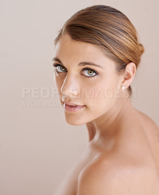 Buy stock photo Portrait, natural beauty and skincare of woman in studio isolated on a brown background. Serious face, shoulder and young model in cosmetics, healthy skin glow or spa facial treatment for dermatology