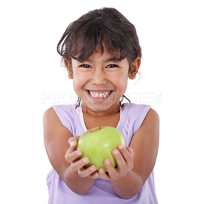 Buy stock photo Portrait of an adorable little girl smiling and holding an apple