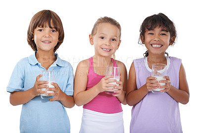 Buy stock photo Milk, glasses and happy portrait of children with nutrition, health and wellness in white background of studio. Calcium, drink and kids smile with dairy, protein and benefits in diet for growth
