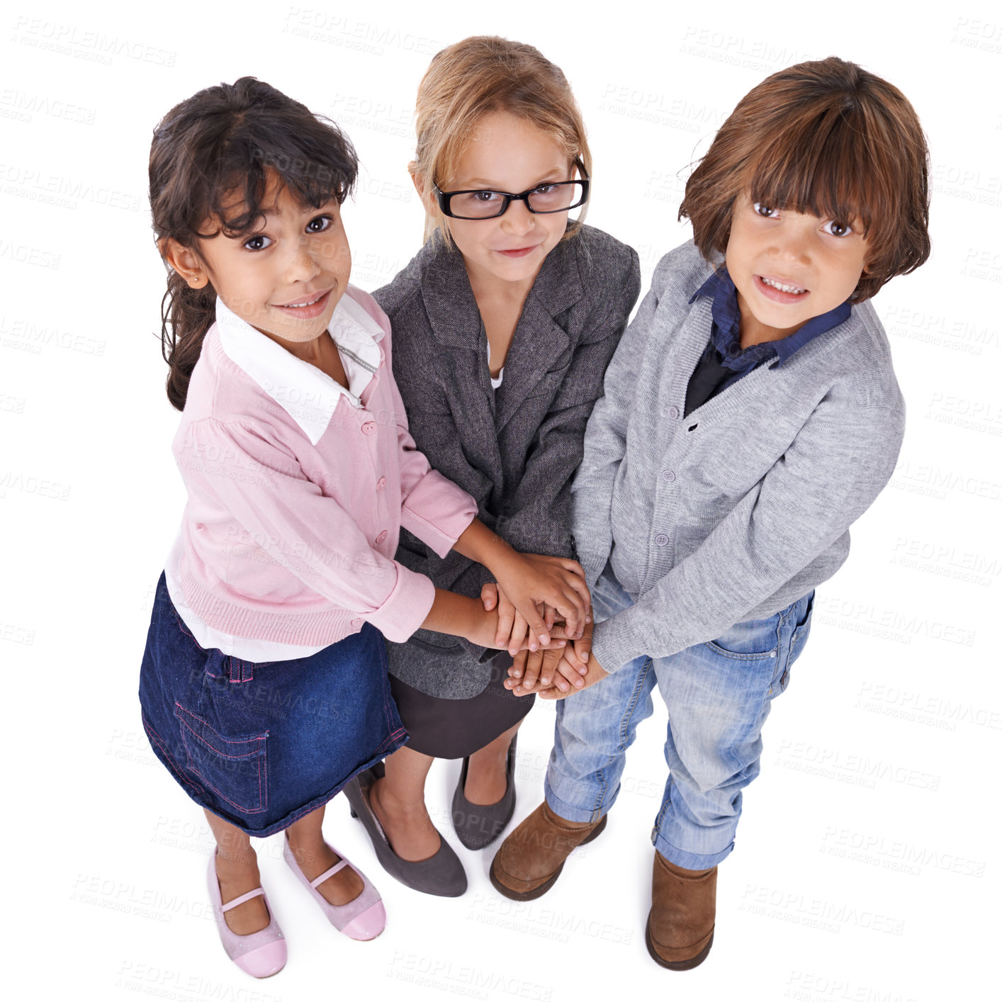 Buy stock photo Portrait, children or business with hands together, group or kids isolated on white studio background. Models, top view or circle with teamwork or cooperation with dress up or clothes with confidence