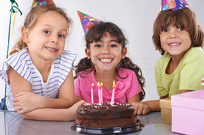 Buy stock photo Friends, kids and birthday cake, party and candles with happy people for celebration, youth and dessert. Special day, together in festive mood and children smile for social event with chocolate