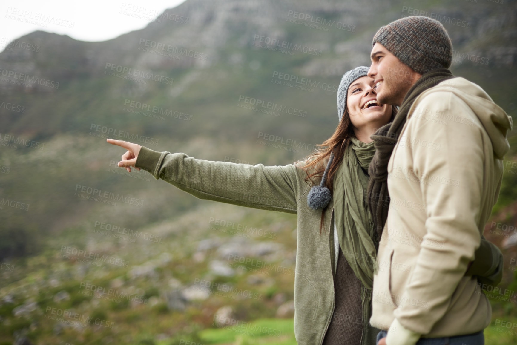 Buy stock photo Smile, hiking and pointing with couple in mountains together for love, dating or sightseeing. Travel, environment or view with happy young man and woman in nature for adventure, holiday or vacation