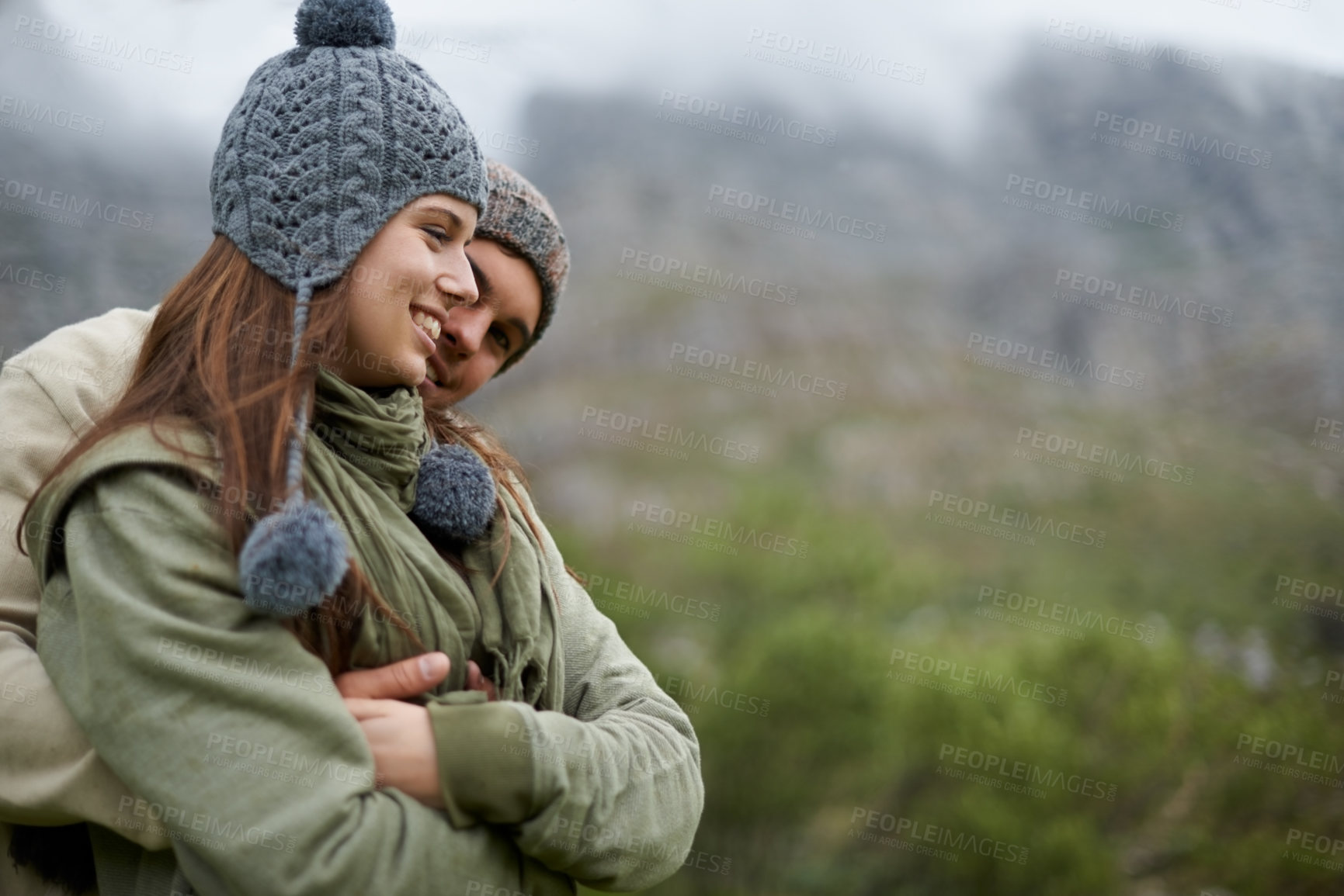 Buy stock photo Couple, hug and smile on hiking vacation in outdoors, love and bonding in relationship for connection. People, embrace and travel for exploring adventure, romance and security in marriage on mountain