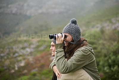 Buy stock photo Hiking, binocular and happy couple on piggyback ride, nature exploration and mountain climbing journey. Camping tour, love and people look at eco friendly destination, trekking view or bird watching