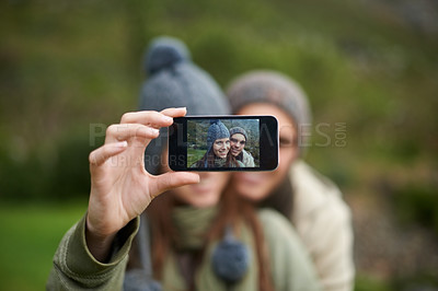 Buy stock photo Couple, selfie and photo while hiking in nature, smartphone and capture moment in outdoors. People, happy and picture for memory and exploring wilderness, trekking and photograph for social media