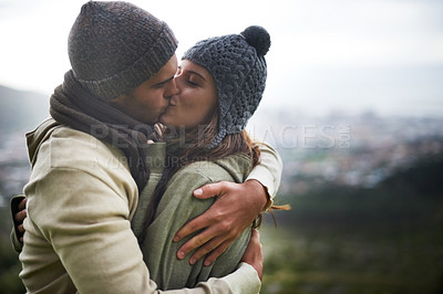 Buy stock photo Couple, kiss and romance outdoor with hug for bonding, love and relationship with travel or holiday. Man, woman and face with embrace or smile on vacation, trip and carefree with mockup space or care