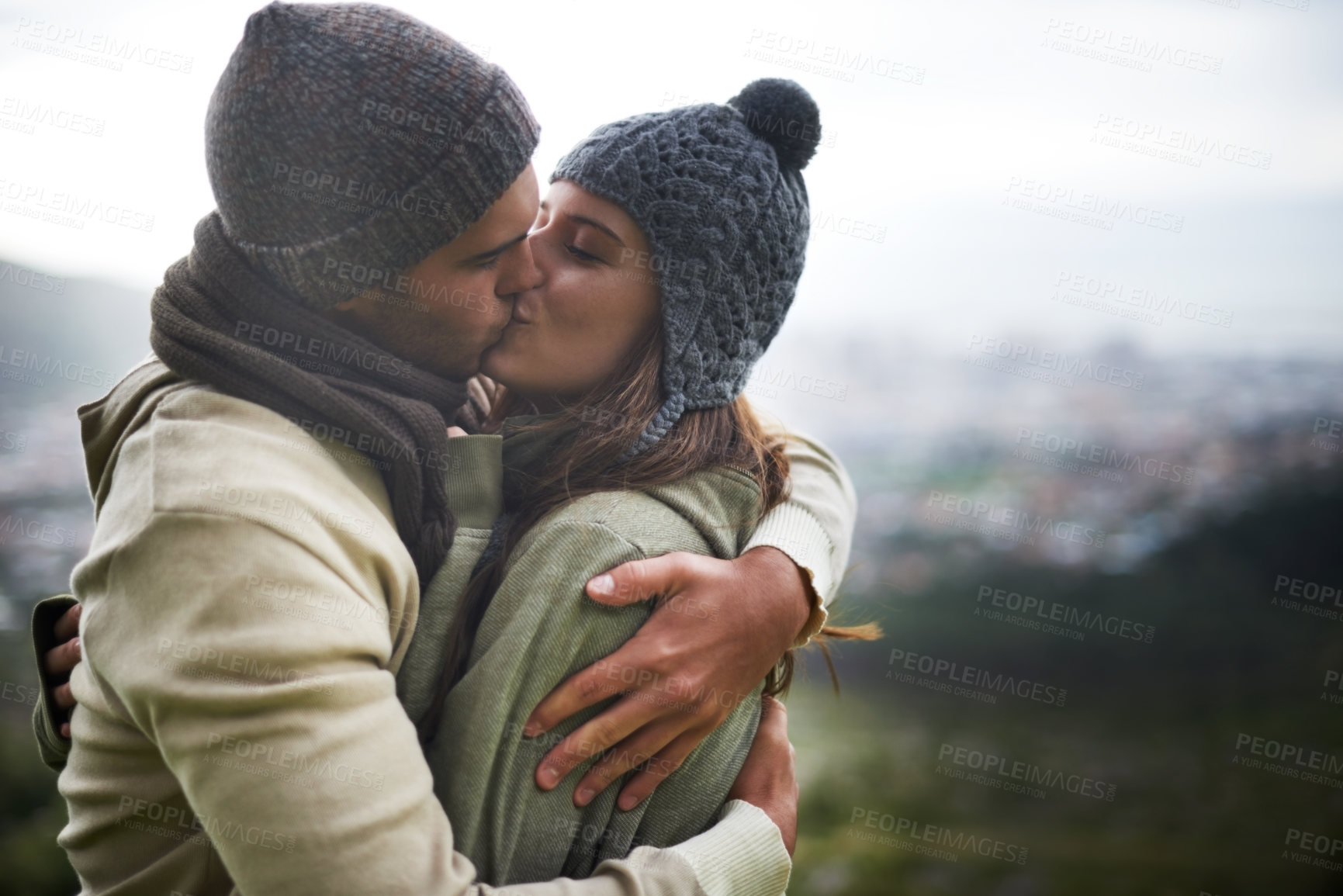 Buy stock photo Couple, kiss and romance outdoor with hug for bonding, love and relationship with travel or holiday. Man, woman and face with embrace or smile on vacation, trip and carefree with mockup space or care