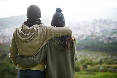 Buy stock photo Nature view, hug and couple looking at city on hiking journey, travel adventure or mountain climbing trip. Marriage, embrace and back of woman, man or people together for bonding, wellness and love