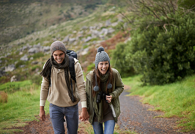 Buy stock photo Laughing, hiking and happy with couple, tourist and walking with backpack, mountain and bonding together. Outdoor journey, adventure and trekking in path, field and exercise for fitness and travel
