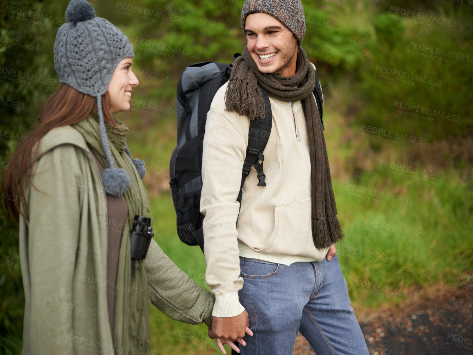 Buy stock photo Forest, hiking and happy couple for holding hands, mountain and travel with backpack, nature and bonding. Outdoor, adventure and trekking in path, woods and winter for travelling and explore