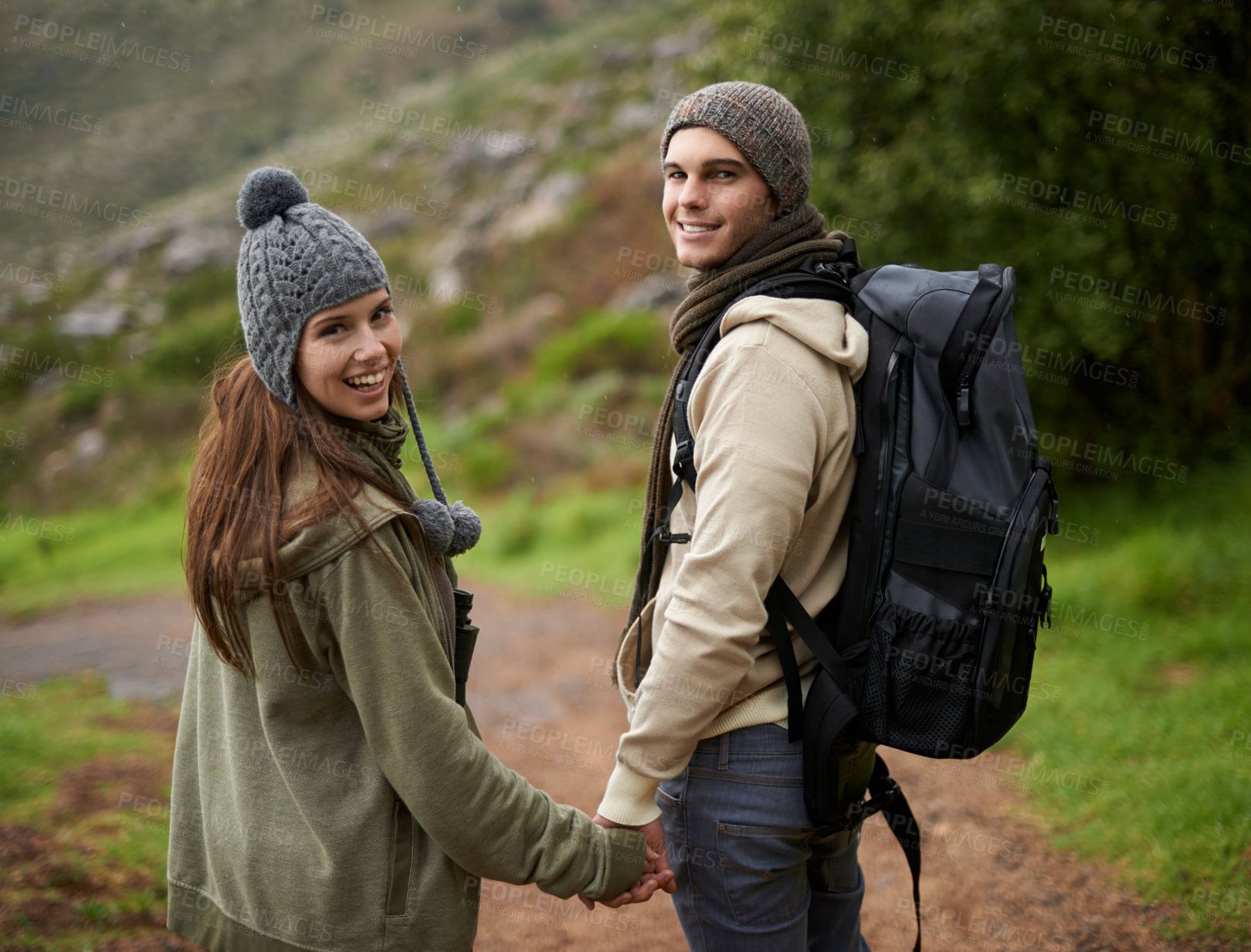 Buy stock photo Happy couple, hiking on mountains and holding hands for outdoor adventure, travel journey and portrait. Young man and woman with love, eco friendly date and walking or trekking in backpack for winter