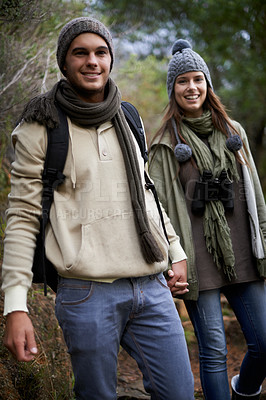 Buy stock photo Couple, portrait and hiking in forest with holding hands for travel, adventure or wellness and fitness. Man, woman and trekking outdoor in woods for cardio, exercise or workout with happy or backpack