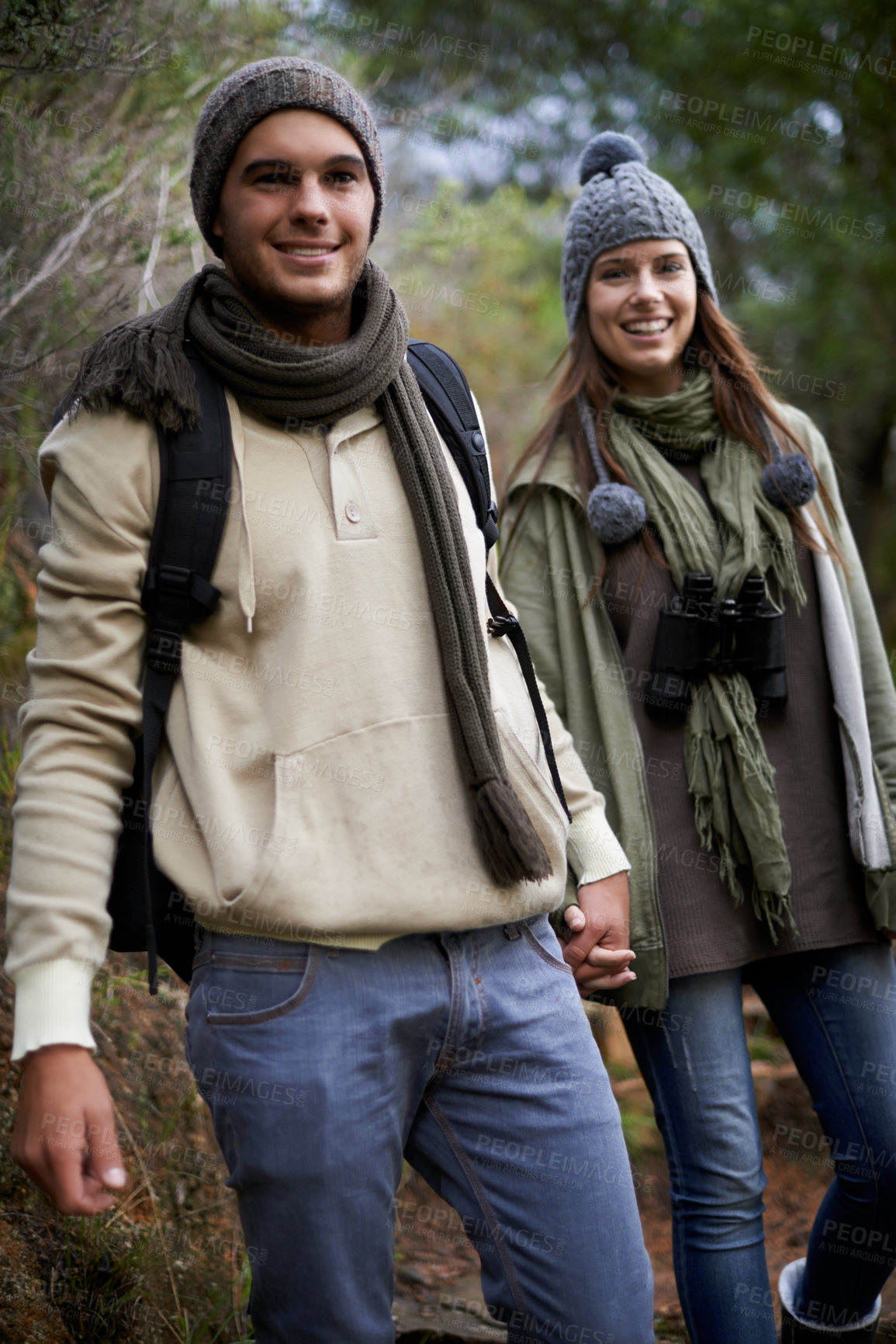 Buy stock photo Couple, portrait and hiking in forest with holding hands for travel, adventure or wellness and fitness. Man, woman and trekking outdoor in woods for cardio, exercise or workout with happy or backpack