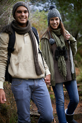 Buy stock photo Couple, portrait and hiking in forest with holding hands for travel, adventure or wellness and fitness. Man, woman and trekking outdoor in woods for cardio, exercise or workout with happy or backpack