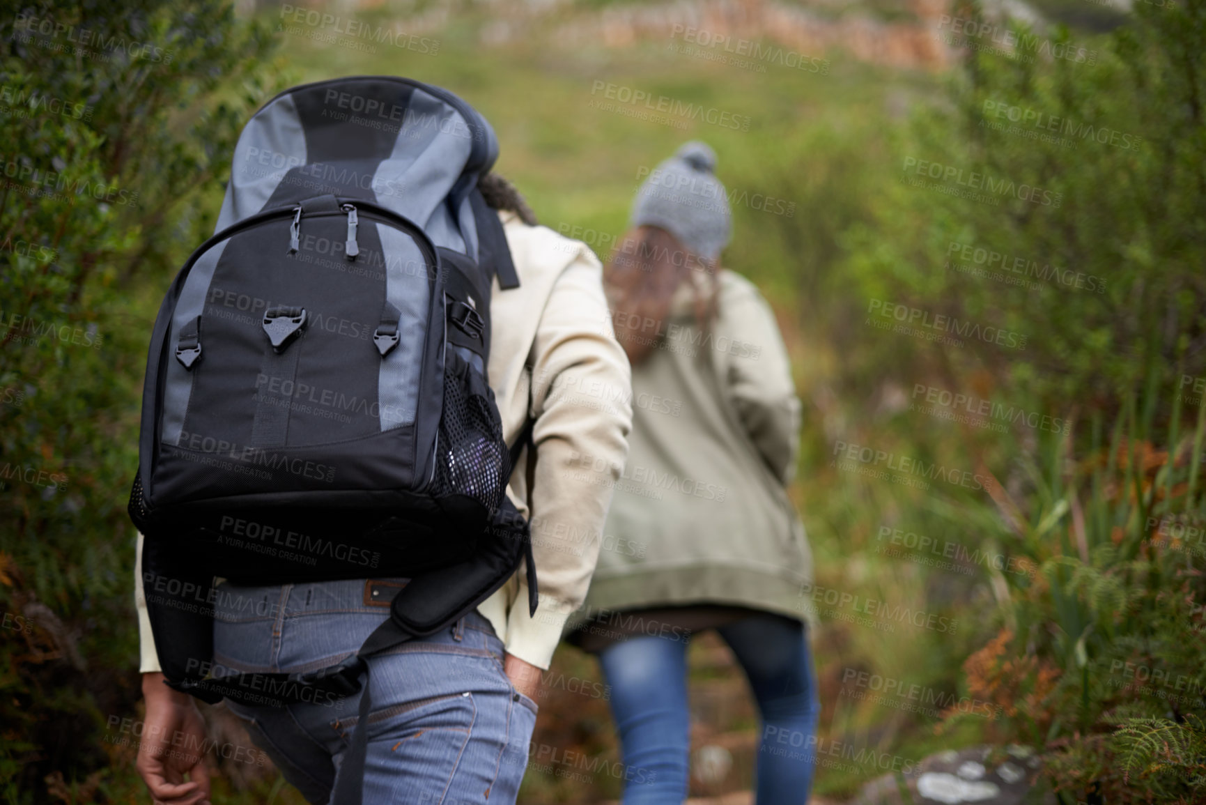 Buy stock photo Couple of friends, hiking in nature for travel, outdoor adventure or journey in forest or eco friendly woods. Back of people walking together or trekking in backpack on mountains path to explore