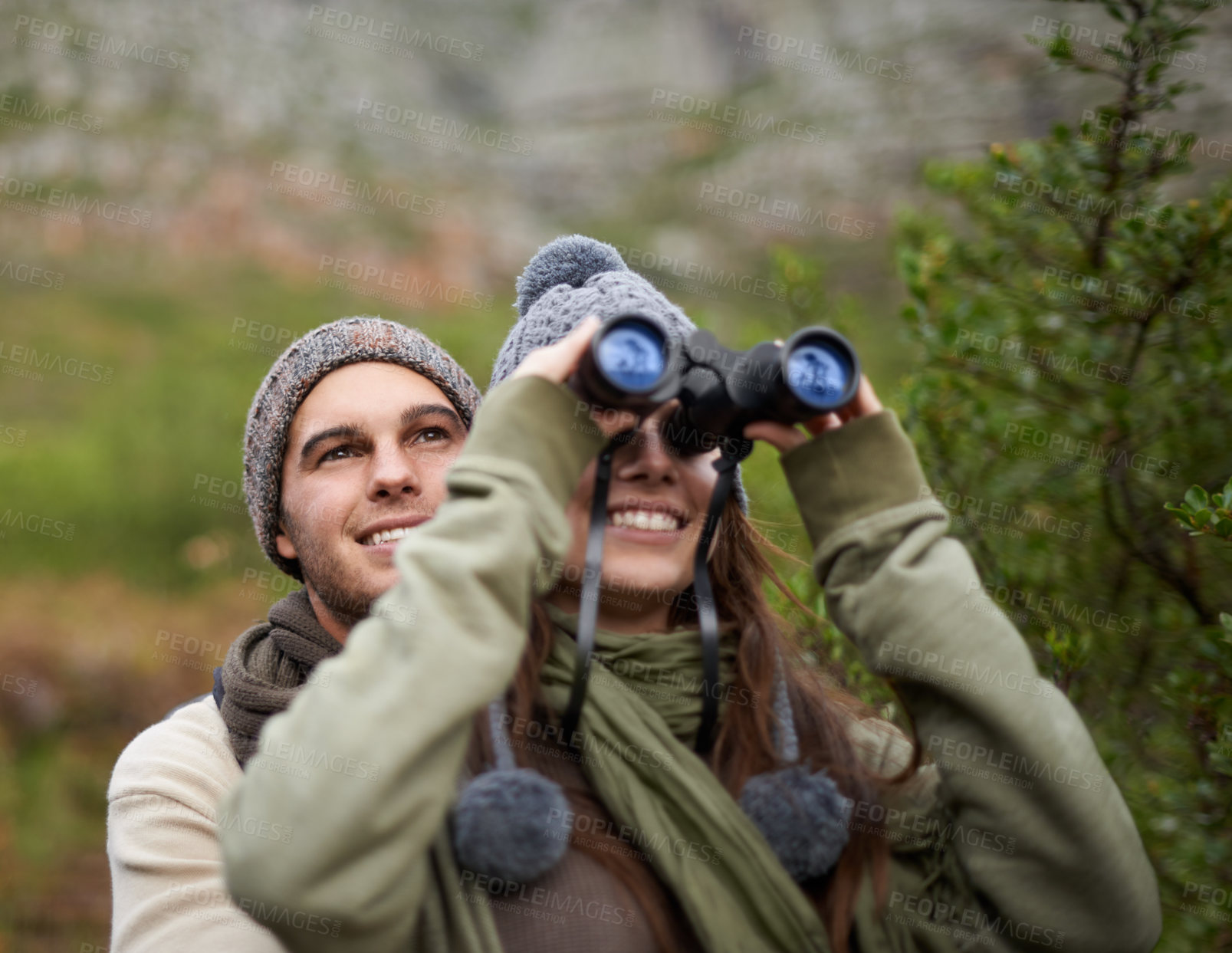 Buy stock photo Couple, love and binocular in nature for travel, adventure or hiking journey and explore together in eco friendly mountains. Happy man and woman trekking with outdoor search, vision or birdwatching