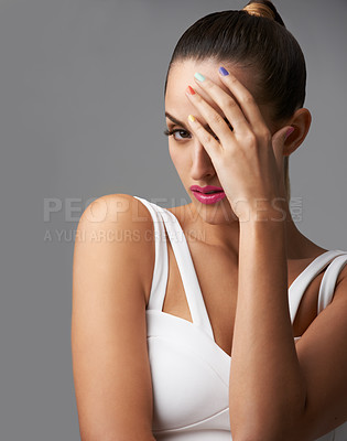 Buy stock photo Portrait of a beautiful young model with colourful nail polish and lipstick
