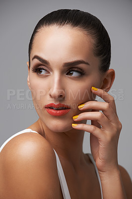 Buy stock photo Woman, face and manicure with lipstick for beauty, yellow nail polish and cosmetics on grey background. Cosmetology, orange lips and hand with color nails, confident in makeup and glamour in studio