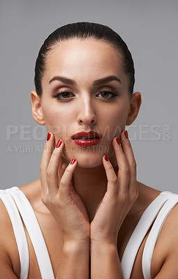 Buy stock photo Woman, portrait and red lipstick with beauty and manicure, nail polish and cosmetic care for skin on grey background. Face, confidence and bold makeup with hands and color nails for glamour in studio