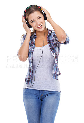Buy stock photo Studio shot of a young woman listening to music on headphones isolated on white