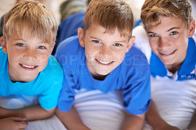 Buy stock photo Friends, brothers and relaxing on bed in portrait, children and care in childhood or smiling at home. Happy siblings, resting and satisfaction in bedroom, love and having fun on vacation or holiday