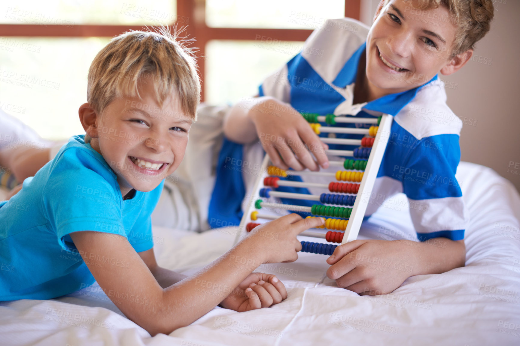 Buy stock photo Children, home and portrait with abacus for learning, happy and bonding together by education toy for math. Brother, smile on face and counting game on bed for sibling love,  and development in house