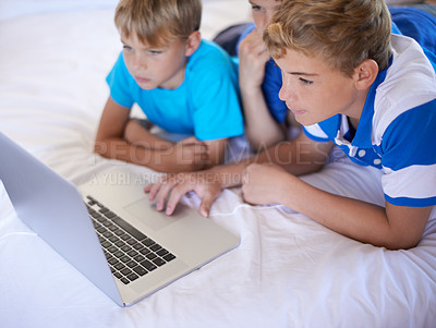 Buy stock photo Kids, siblings and boys on a bed with laptop for streaming, movie or video at home bonding. Family, watching and children in a bedroom with pc, internet or search for social media, gaming or cartoon