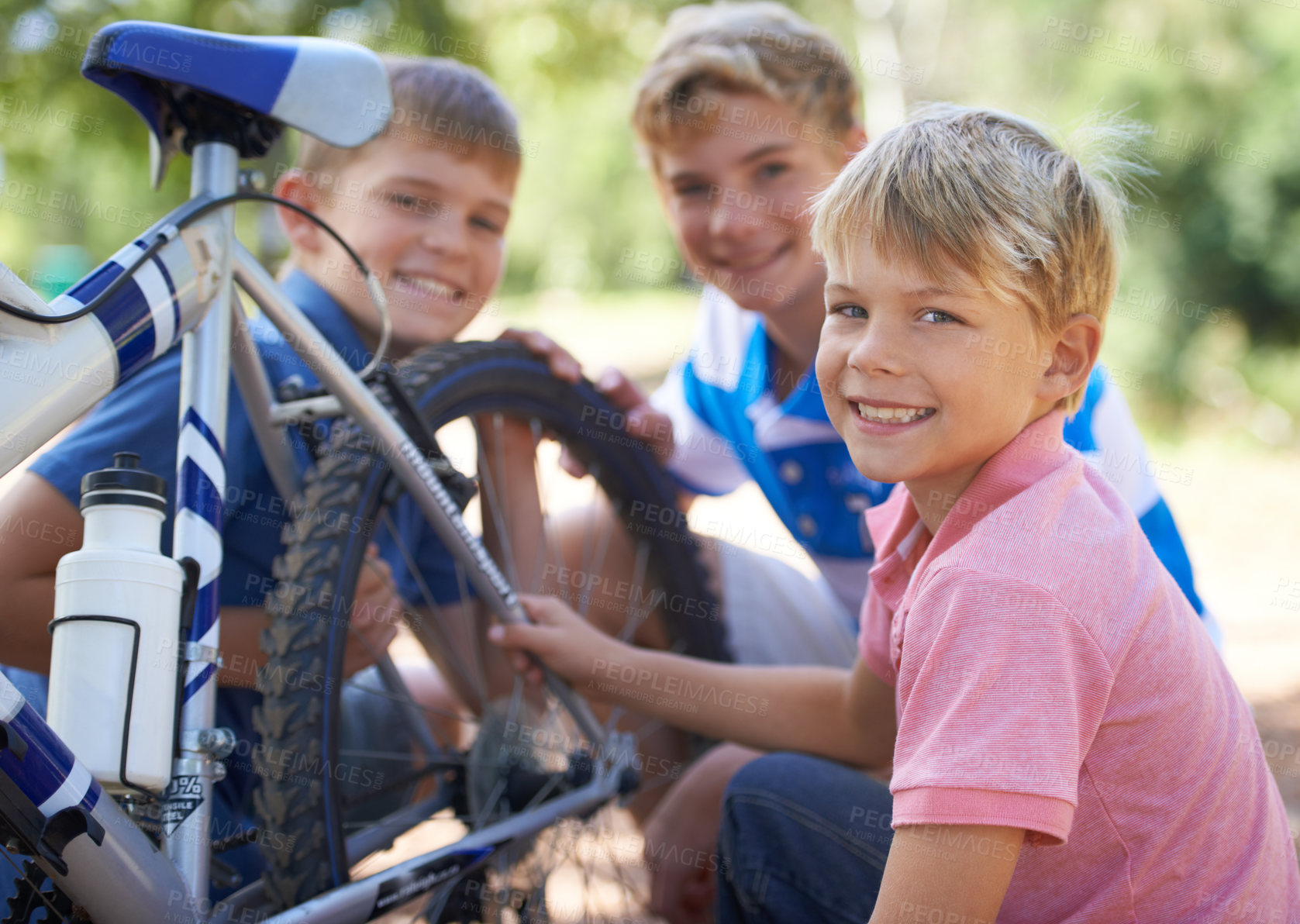 Buy stock photo Children, bicycle and portrait for fixing in park, repairs and excited for fun outdoor on vacation. Young brothers, face or bike maintenance in skill development, care or bonding in summer on holiday